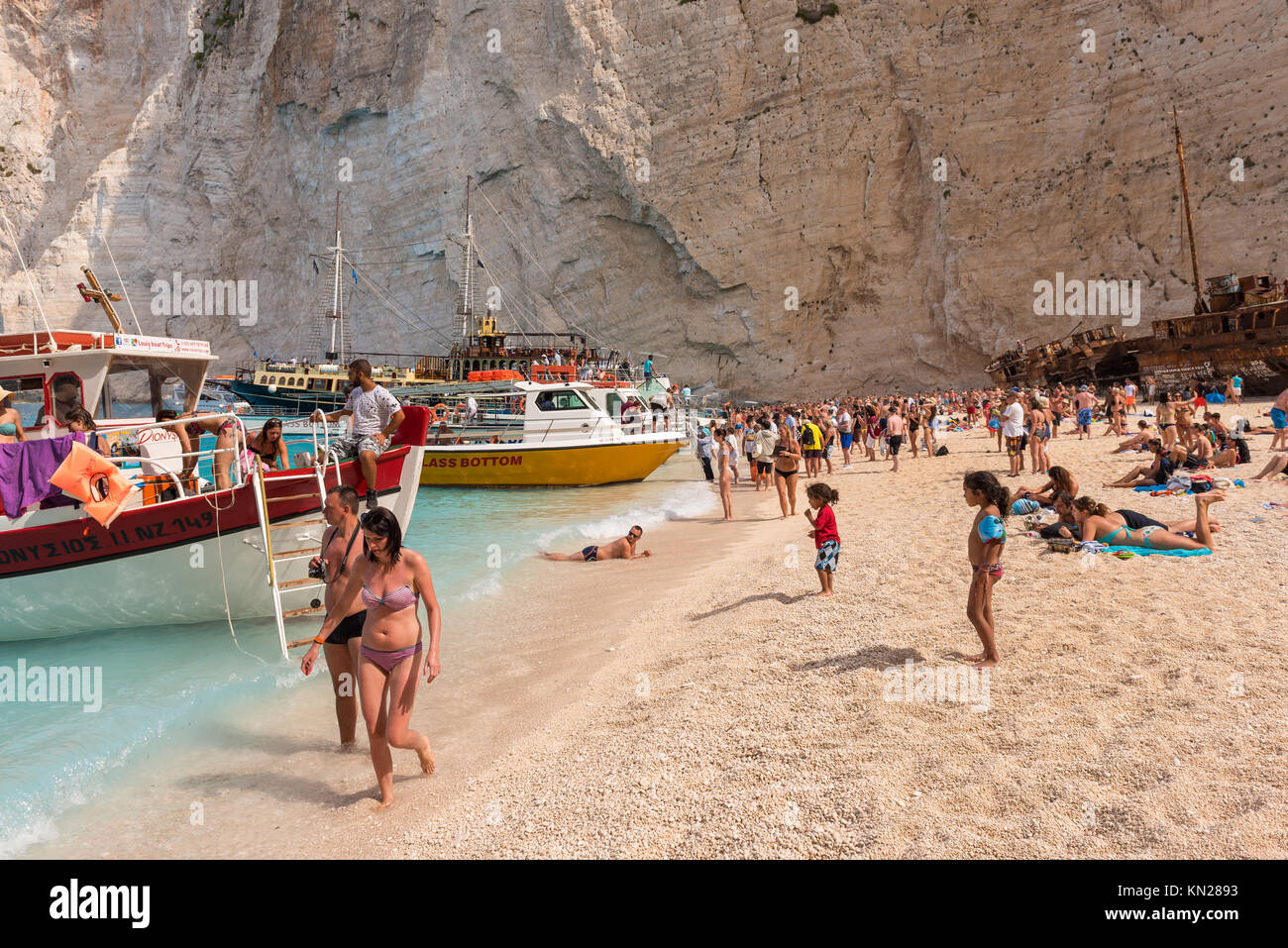 ZAKYNTHOS, GREECE, September 27, 2017: Full beach of people and rental ...