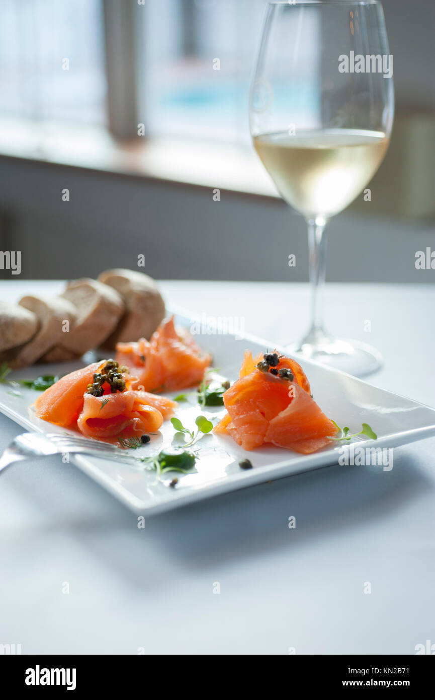 USA Virginia VA Williamsburg Winery plate of smoked salmon with white wine and bread at the Cafe Provencal Stock Photo