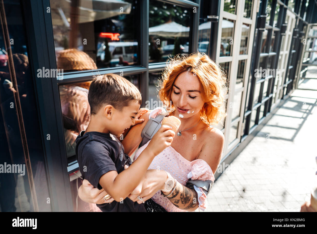 mom and son eat ice cream together Stock Photo