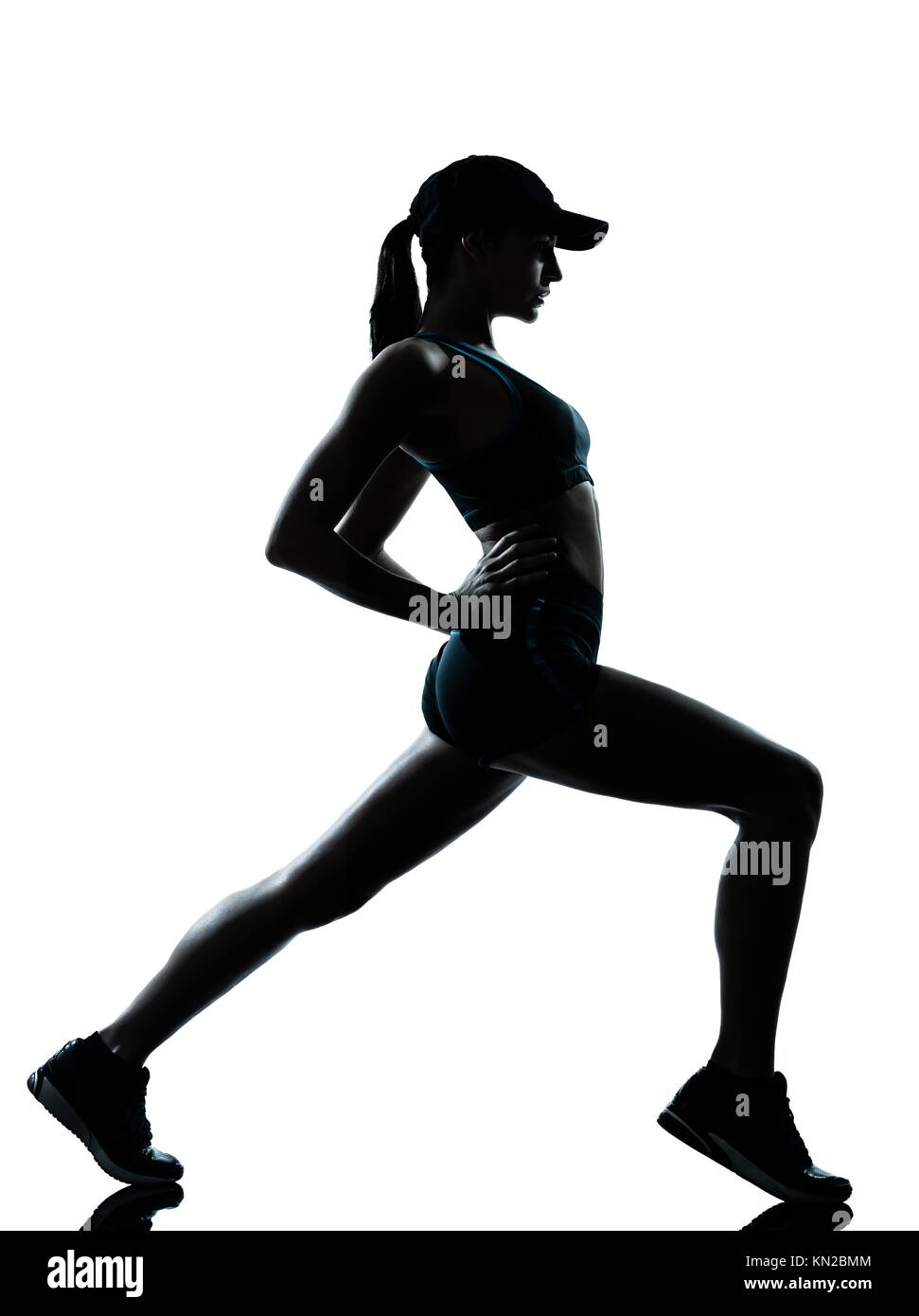 one caucasian woman runner jogger stretching warm up in silhouette