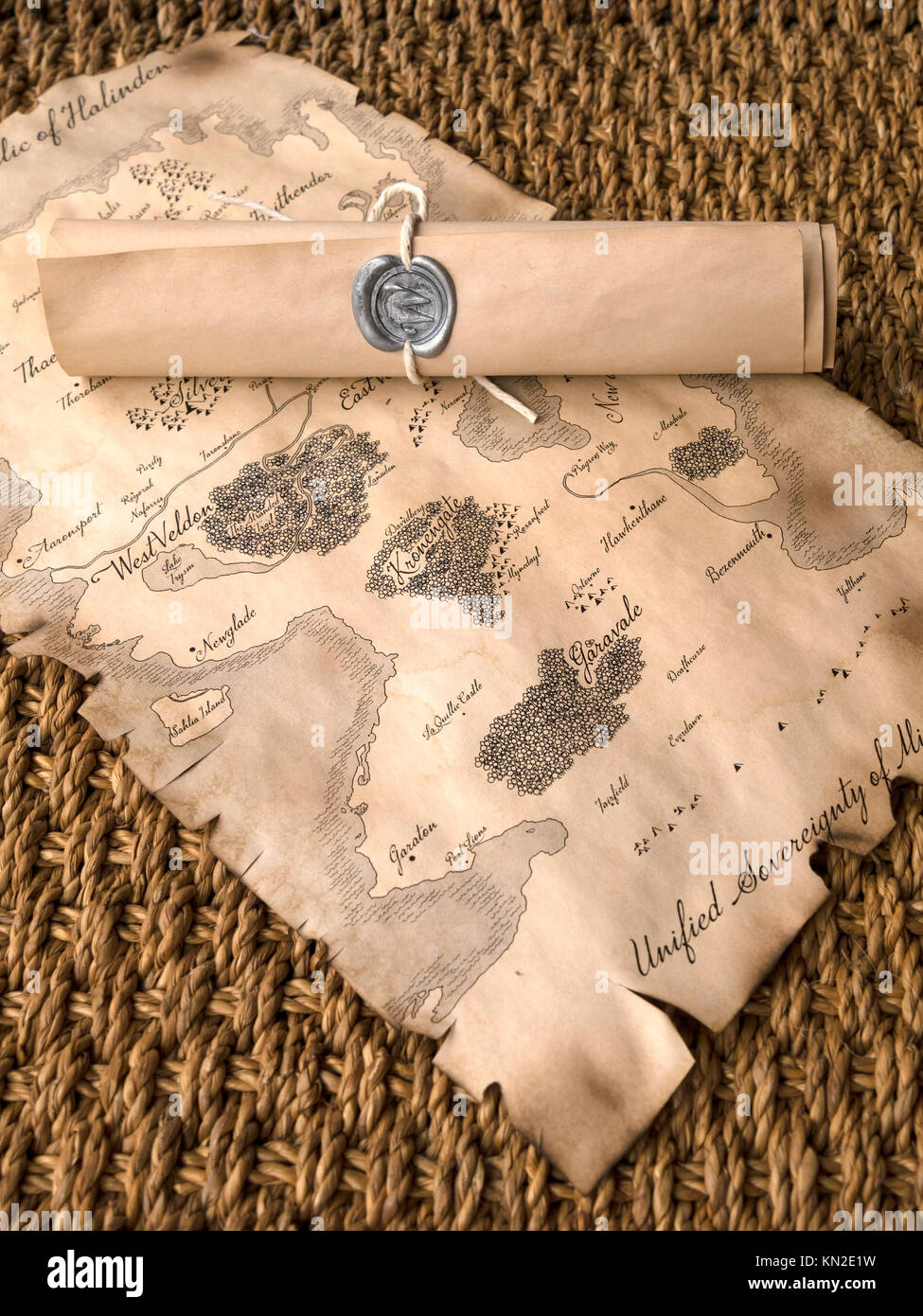 Fantasy roll playing game map with sealed scroll Stock Photo