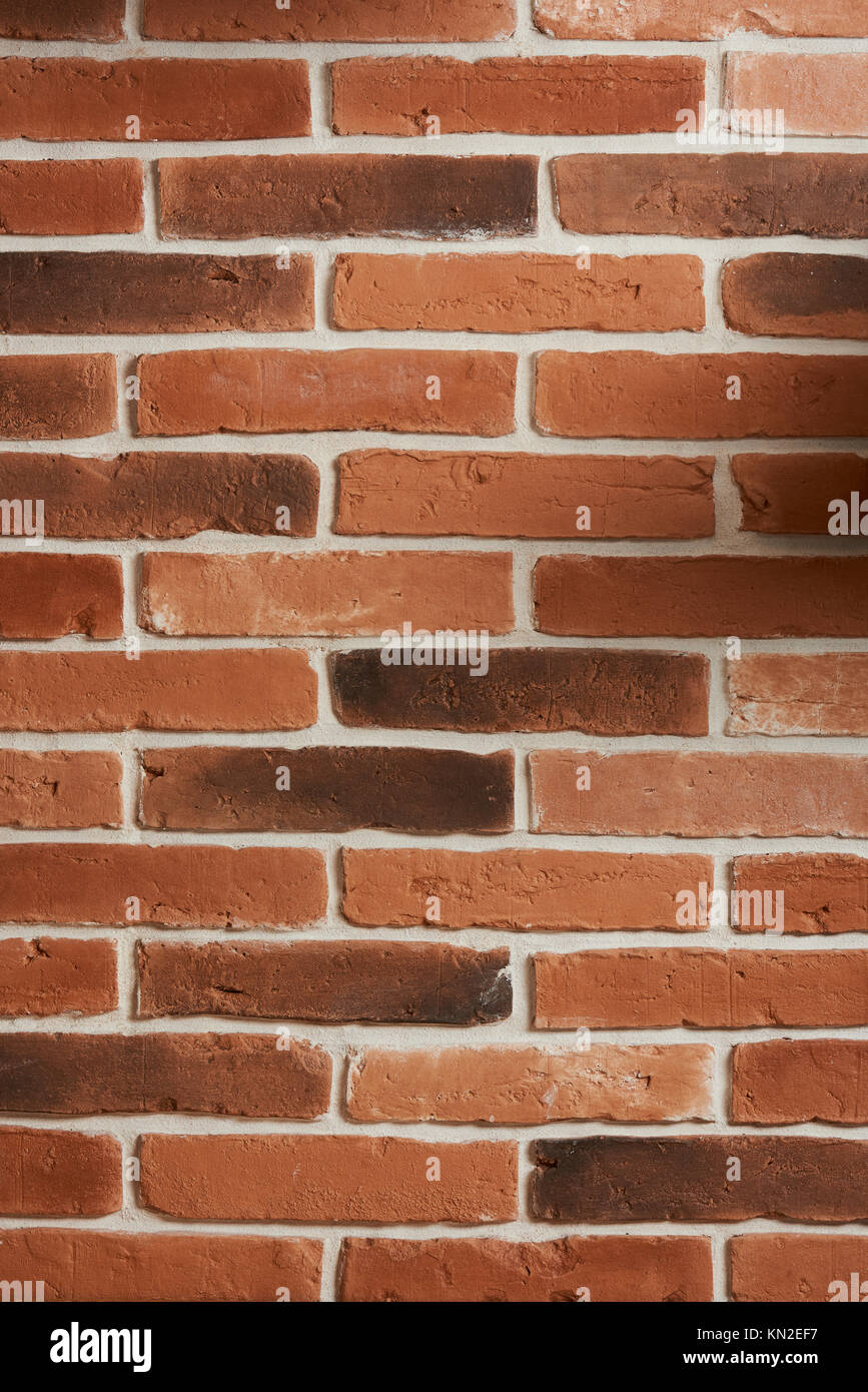 Vertical red brick wall texture background. Clean red brick block wall Stock Photo