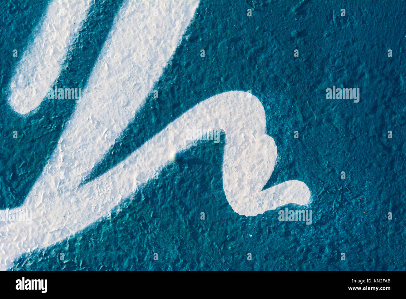 abstract graffiti on rough concrete surface Stock Photo