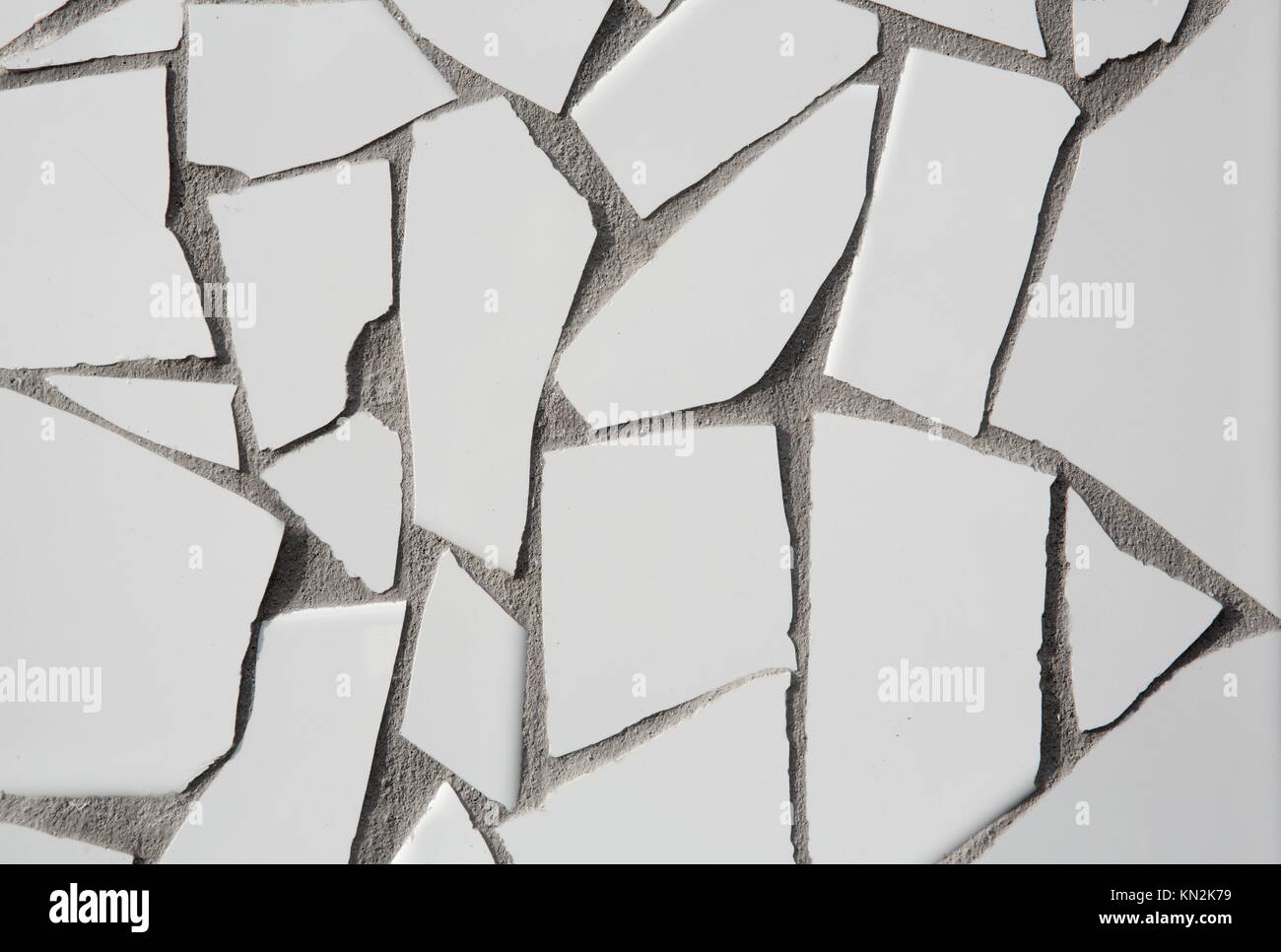 trencadis mosaic of white broken tiles in Mediterranean with cement