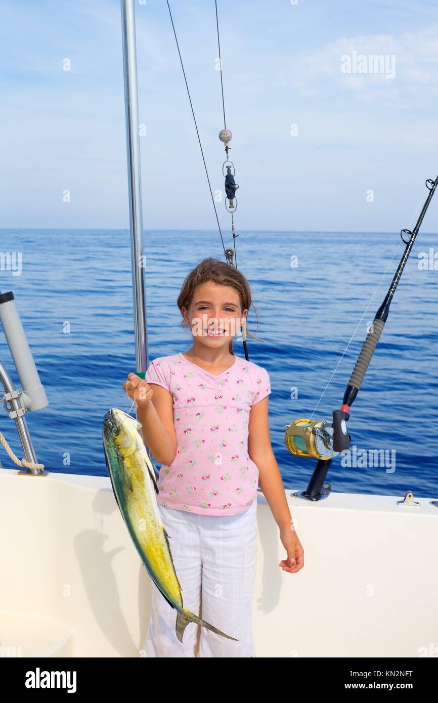 child girl fishing in boat with mahi mahi dorado fish catch with
