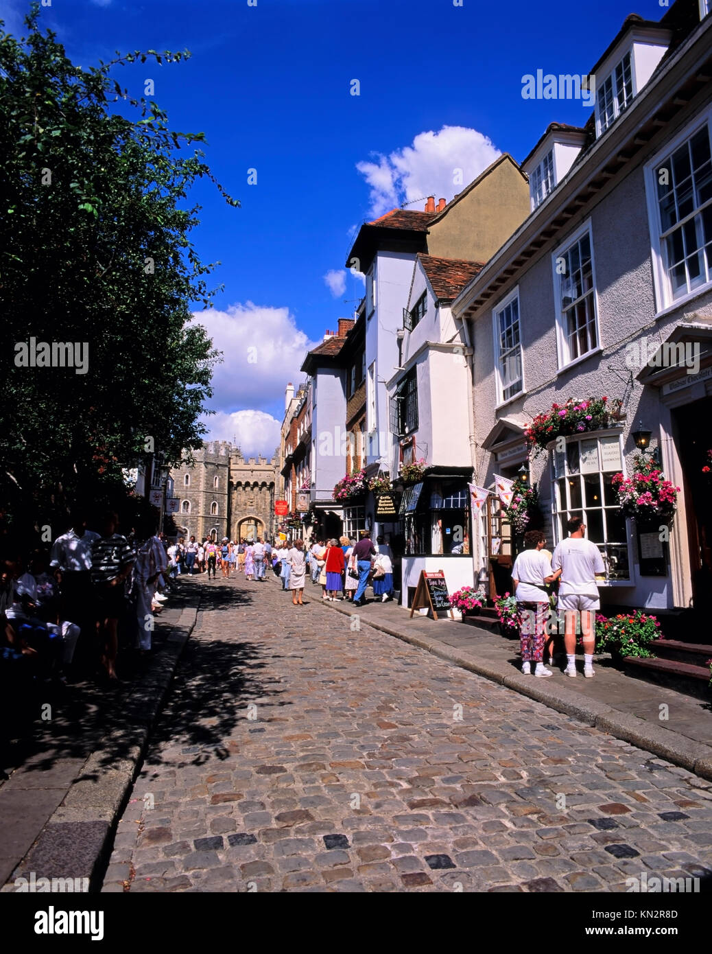 The medieval cobbled Church Street with Windsor Castle in the distance, Church Street, Windsor, Berkshire, England, United Kingdom Stock Photo