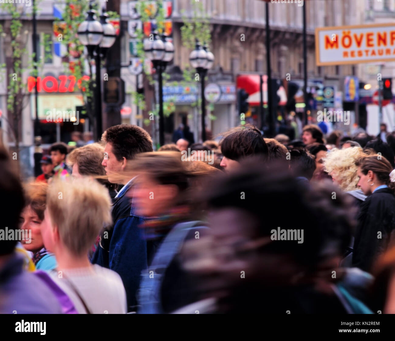 Crowded street full of shoppers, Leicester Square, London, England, United Kingdom Stock Photo