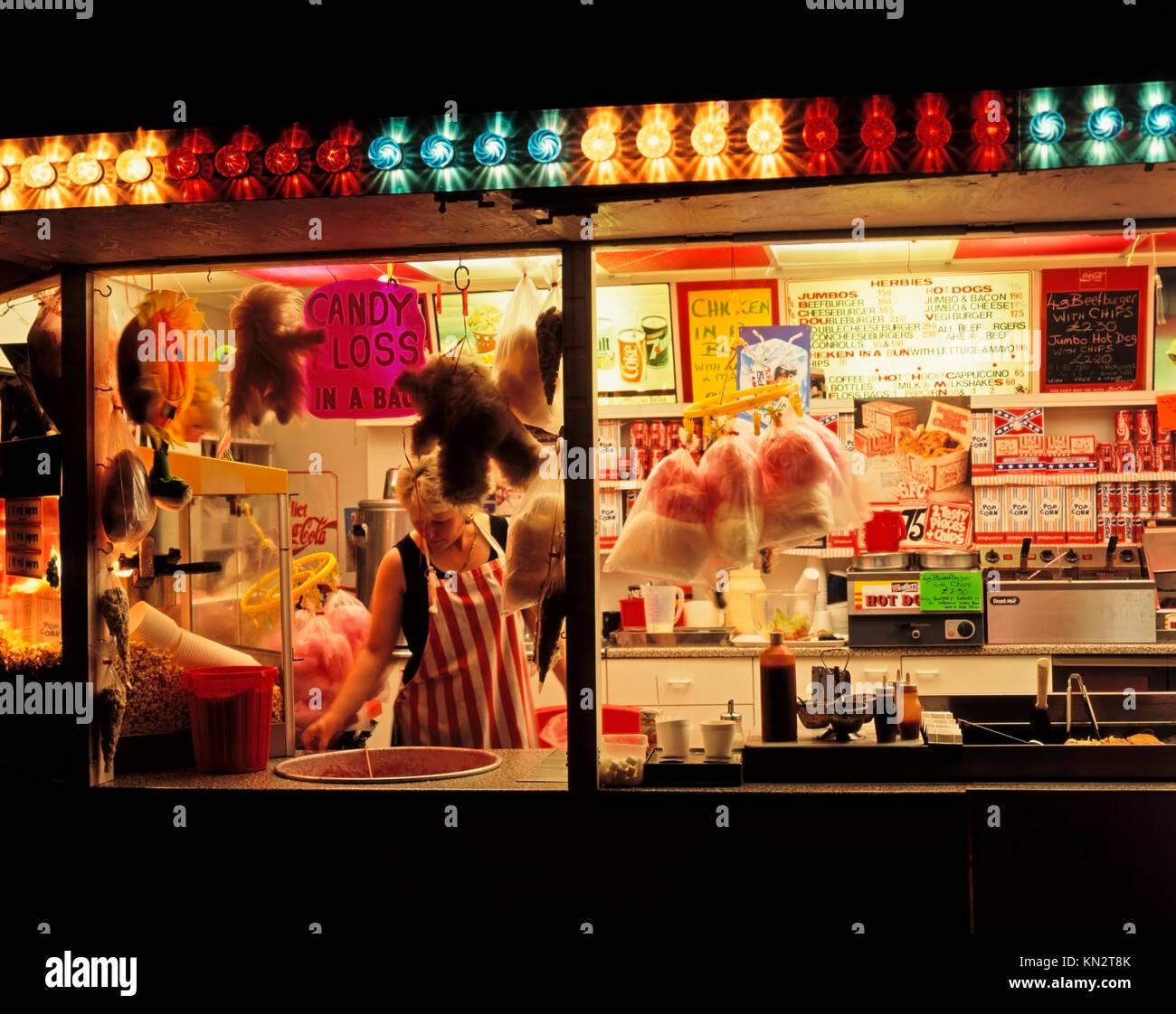 Lady spinning candyfloss or cotton candy, candyfloss stall, Marine