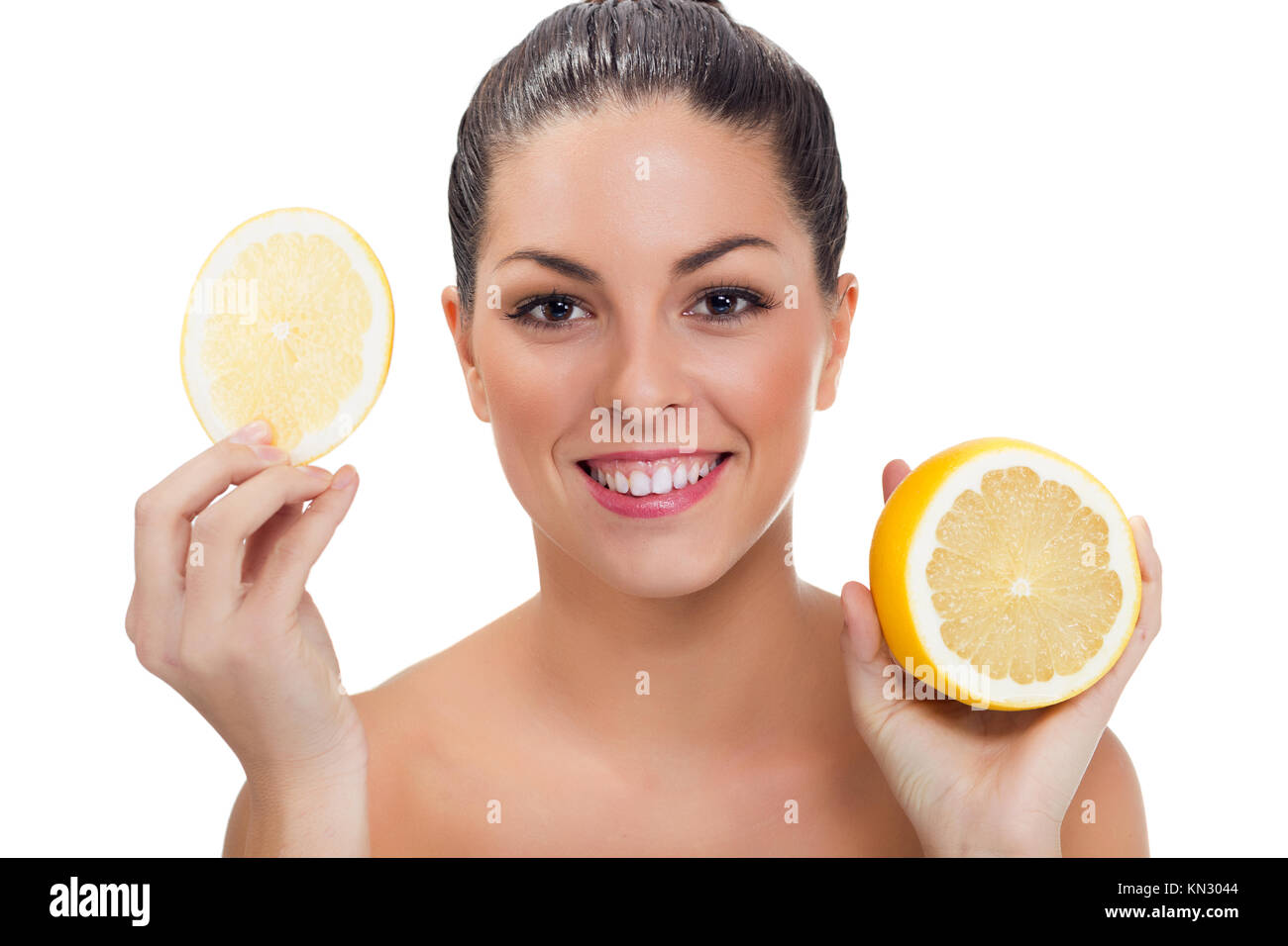 Beautiful woman with half of lemon Stock Photo