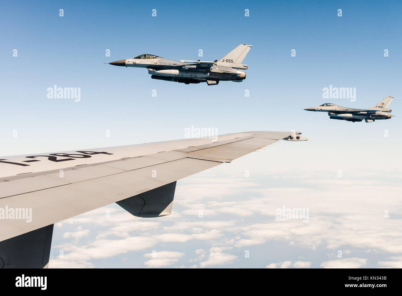 Two F-16 fighter jets of the Royal Netherlands Air Force during a tanker mission with a KDC-10 over the North Sea. Stock Photo