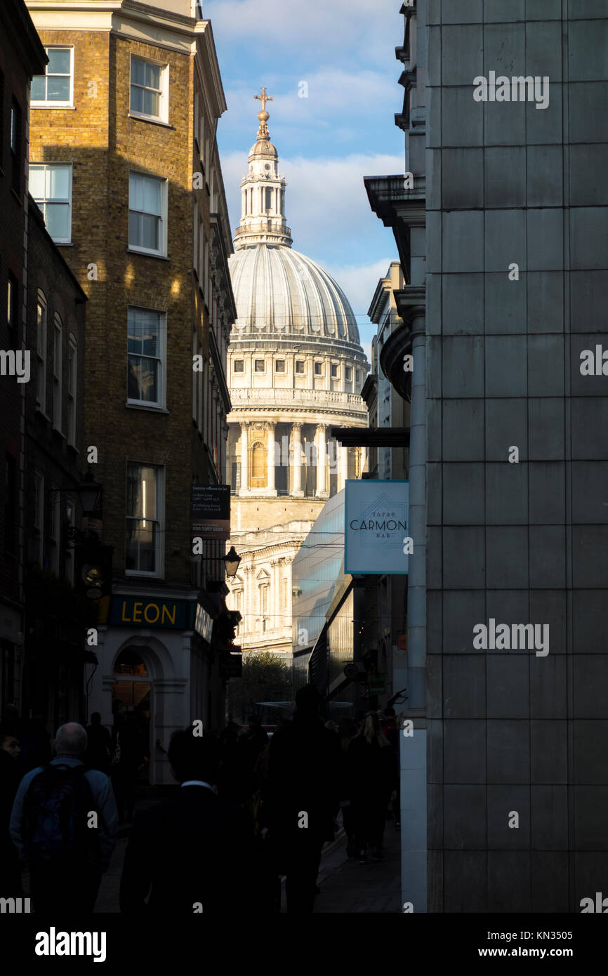 View of St Paul's Cathedral along Watling Street, a narrow historic street in the City of London, UK Stock Photo