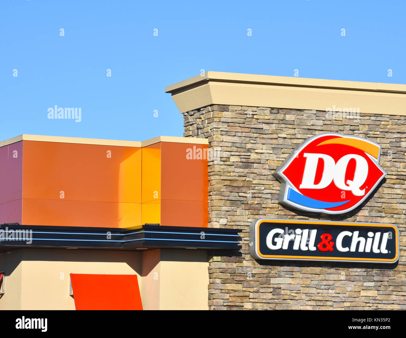 The Dairy Queen sign with the DQ logo and Grill & Chill underneath. The DQ  is a fast food restaurant that has grilled food like hamburgers and ice cr  Stock Photo -