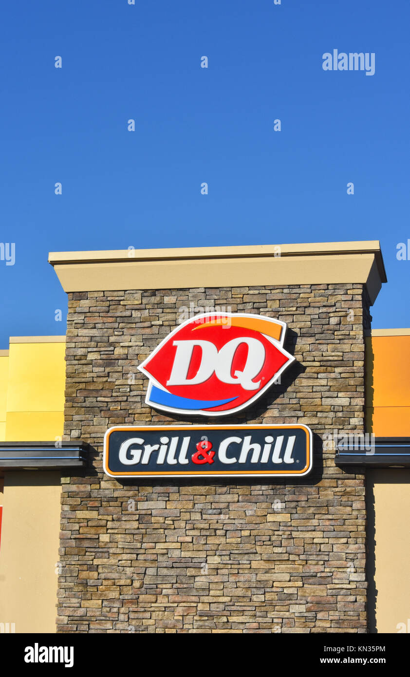 krone indvirkning inden for The Dairy Queen sign with the DQ logo and Grill & Chill underneath. The DQ  is a fast food restaurant that has grilled food like hamburgers and ice cr  Stock Photo -