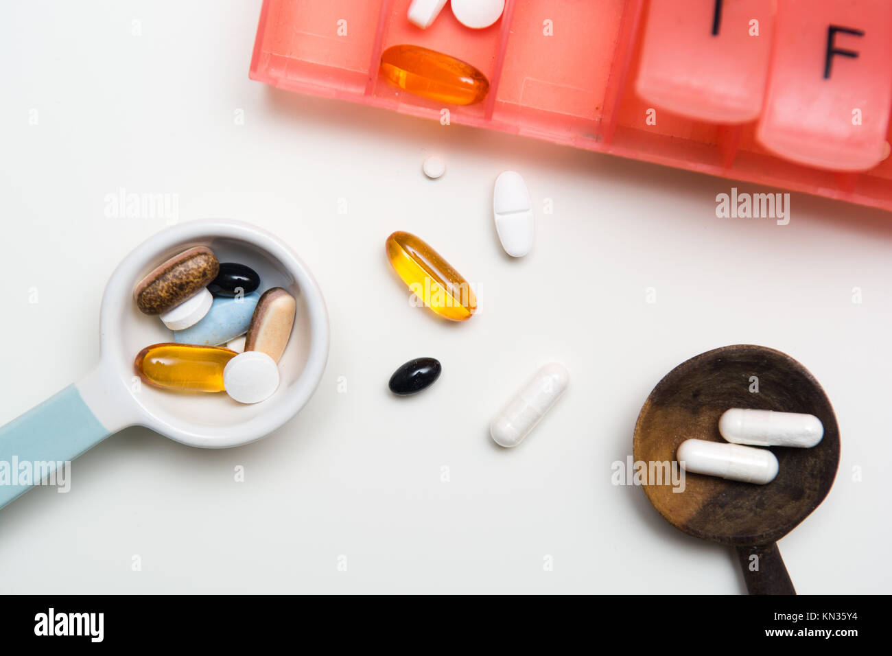 Medicine measured out for a daily dose to take tablets Stock Photo Alamy