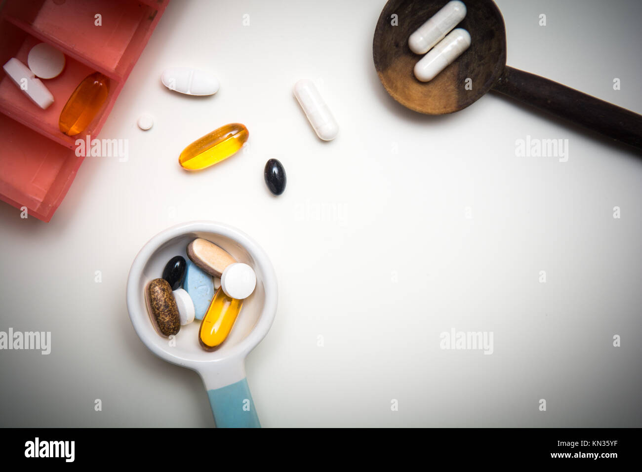 Medicine measured out for a daily dose to take tablets Stock Photo Alamy