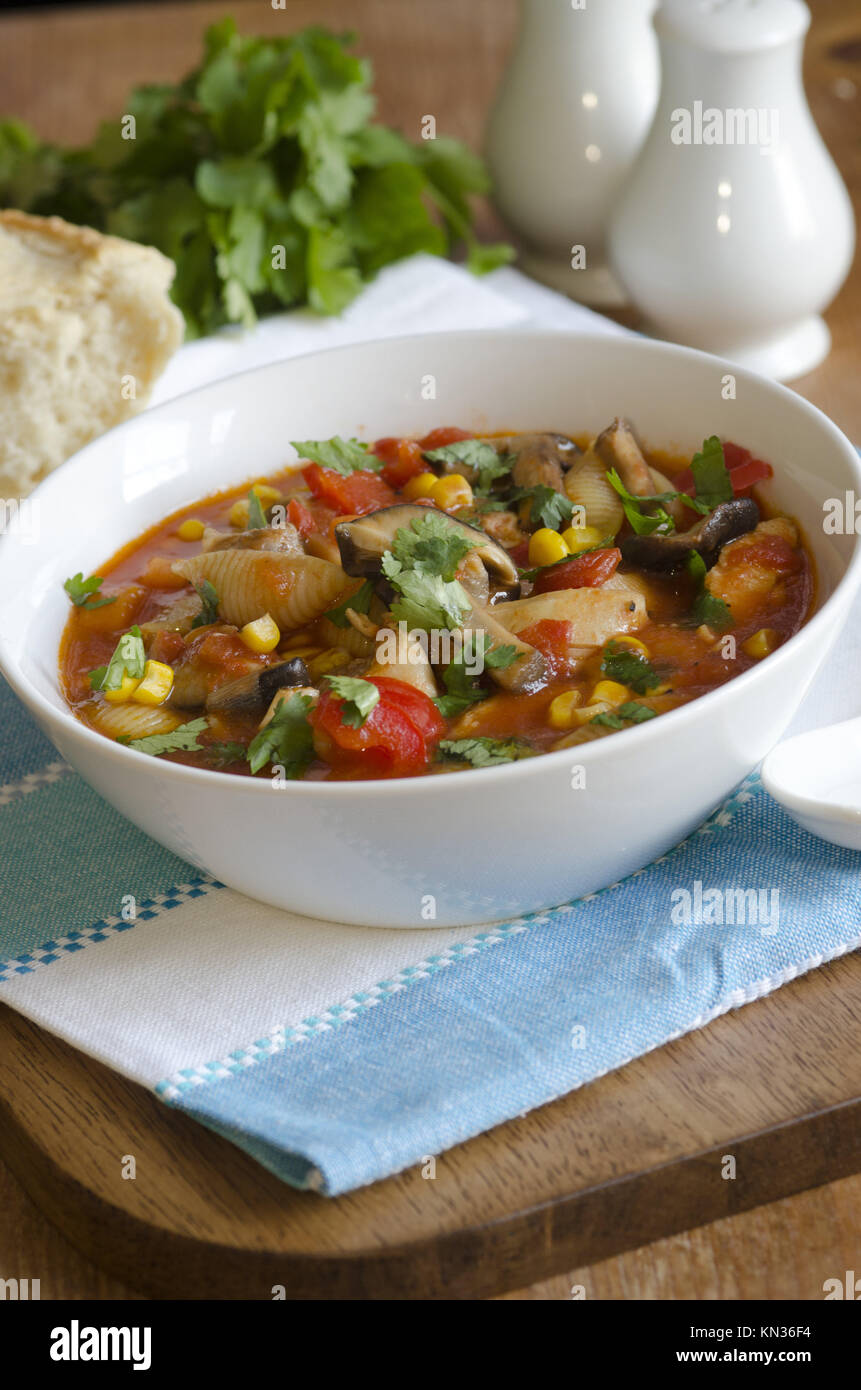 Chicken, pasta shell and vegetable soup in a bowl Stock Photo Alamy