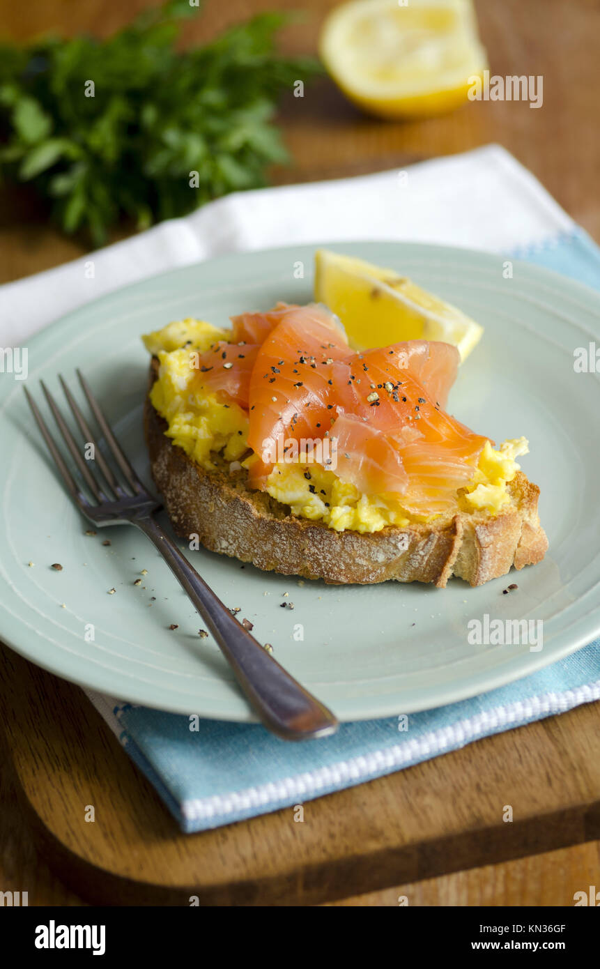 Scottish smoked salmon with scrambled eggs on toast Stock Photo Alamy