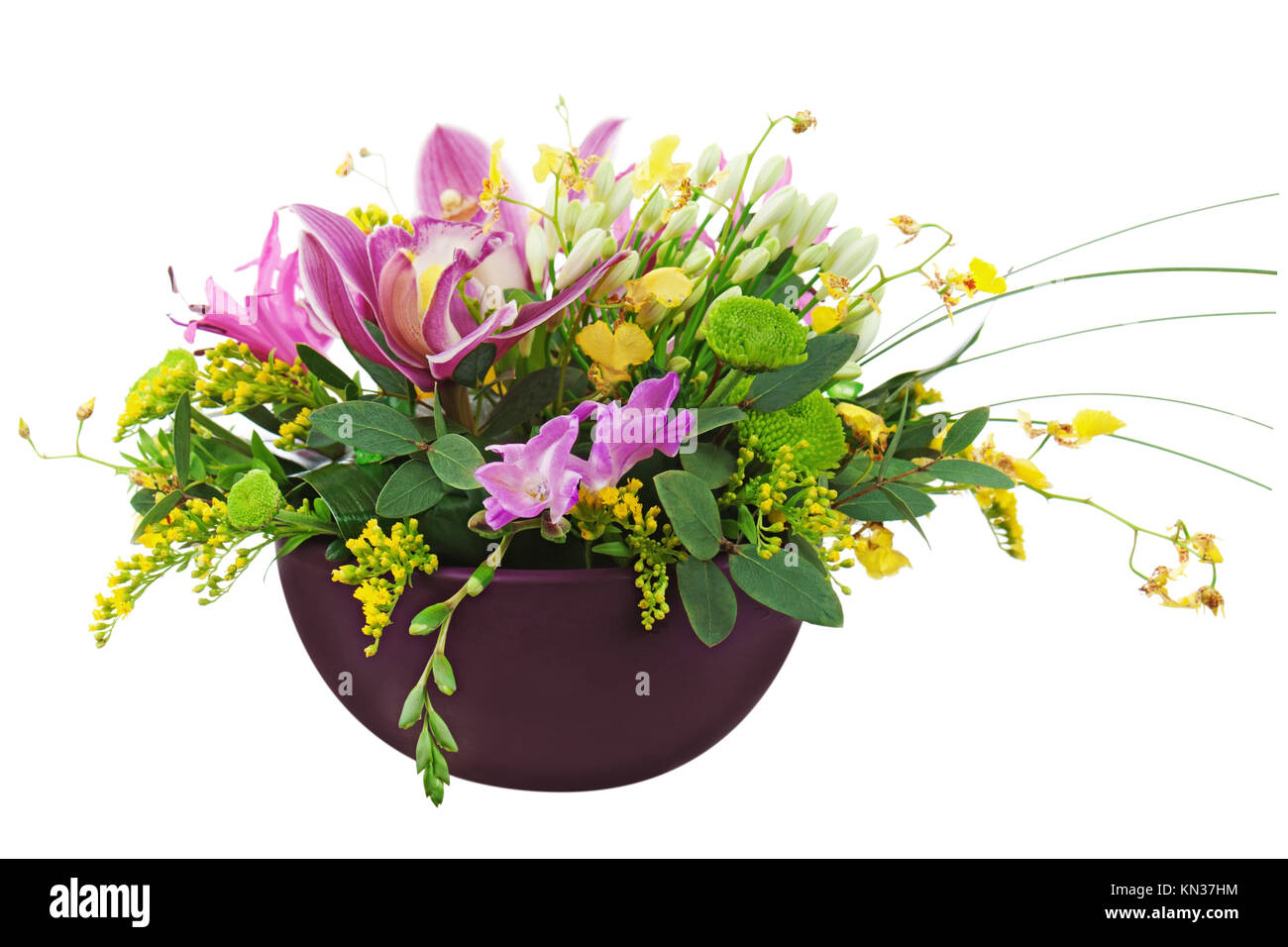 Bouquet from orchids and lilies in vase isolated on white background