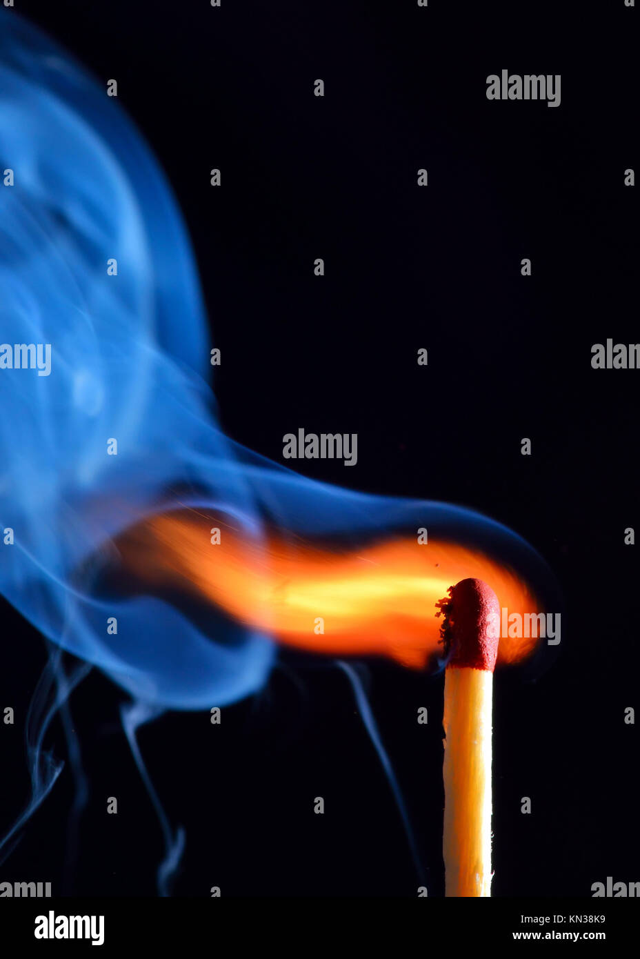 lighting a match on black background Stock Photo Alamy