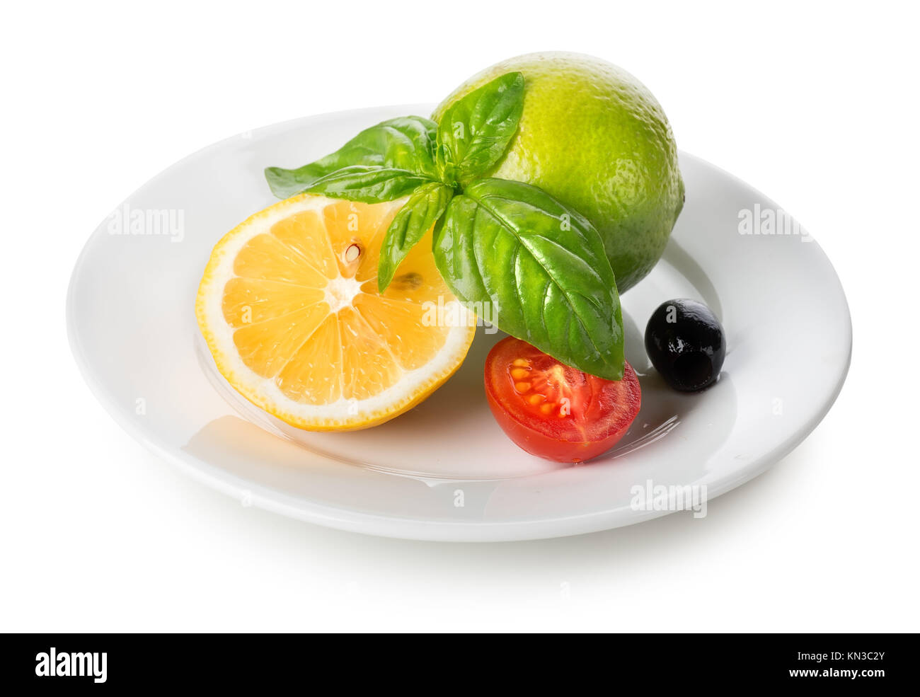 Citrus fruits and vegetables in plate isolated on white Stock Photo Alamy