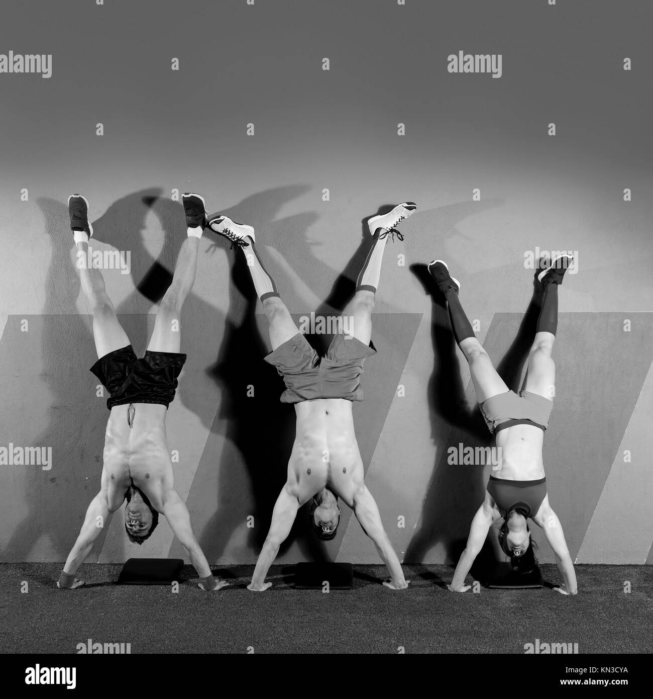 Handstand pushup group pushups workout top position at gym Stock Photo Alamy