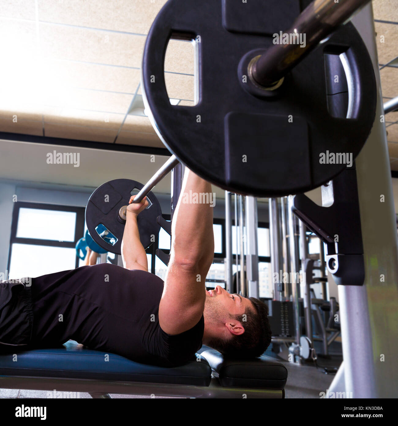 Bench press weightlifting man with in fitness gym Stock Photo Alamy