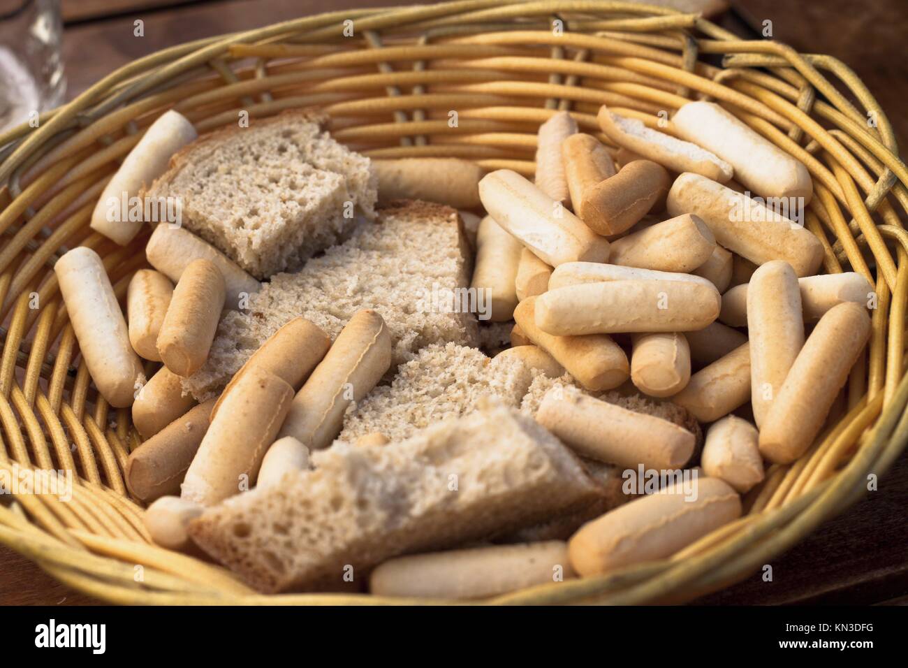 Detail of basket with bread and bread sticks in Spanish Tapas
