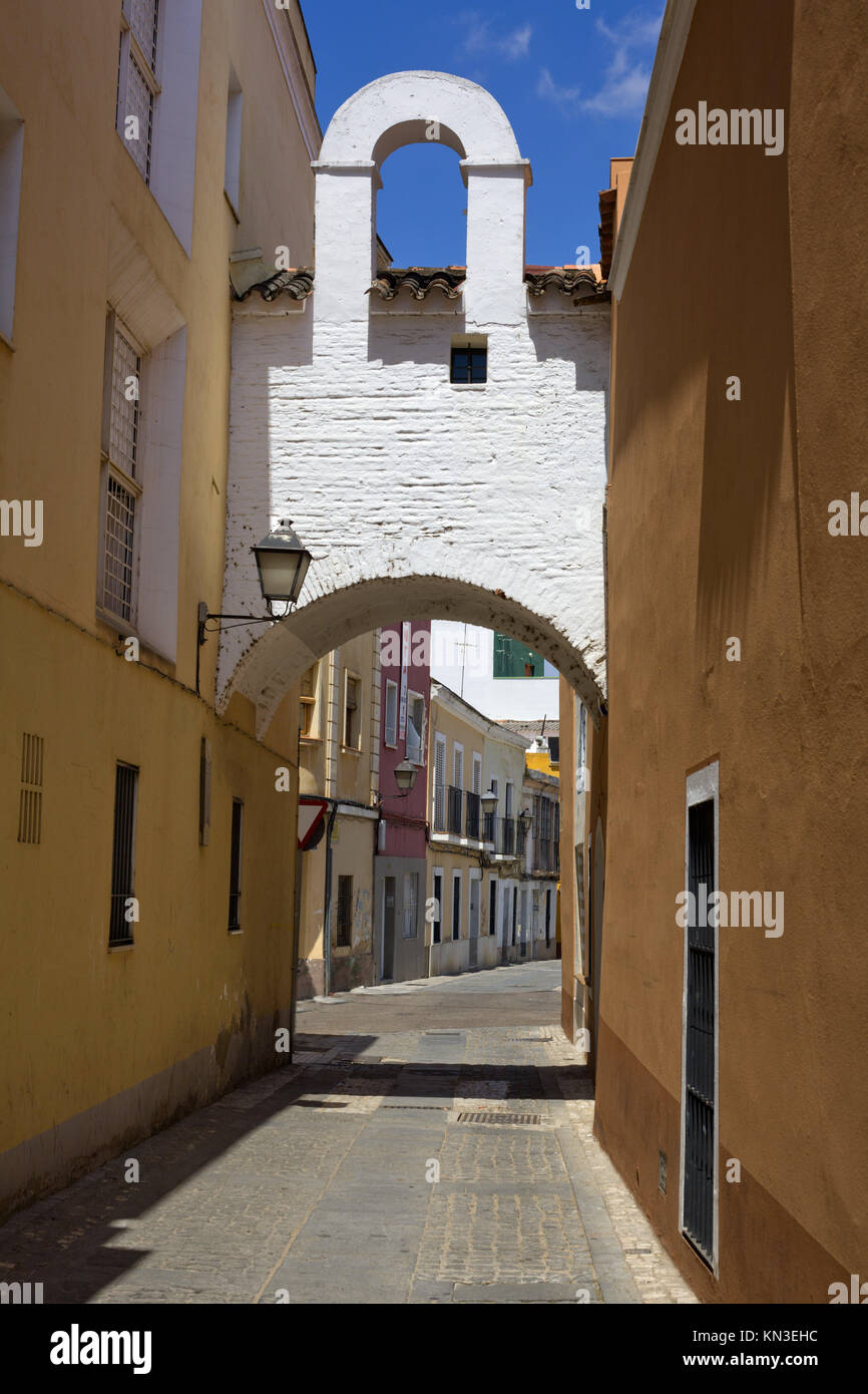 Badajoz downtown old village in white whitewashed typical arch, Spain. Stock Photo