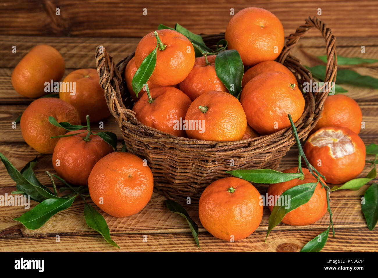 Mandarins basket organic fruits in close-up Stock Photo