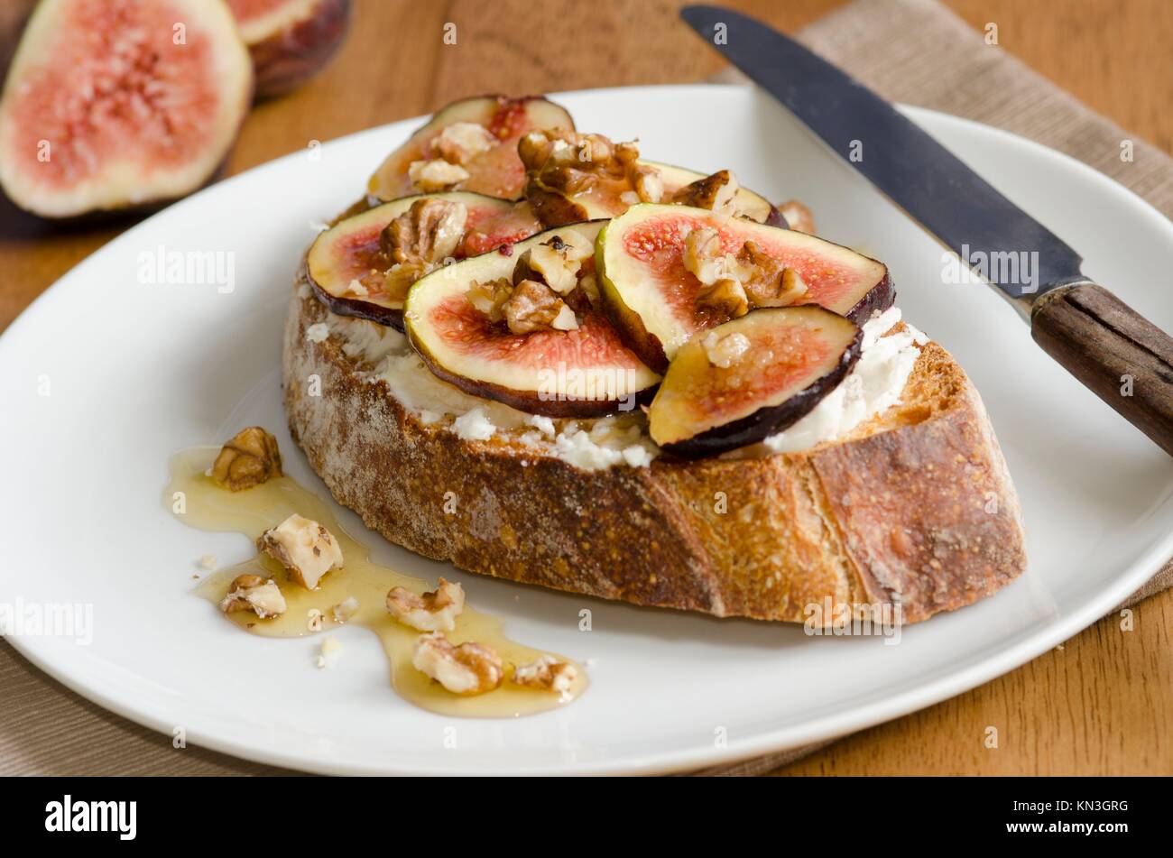 Toast with honey-roast figs and nuts. Stock Photo
