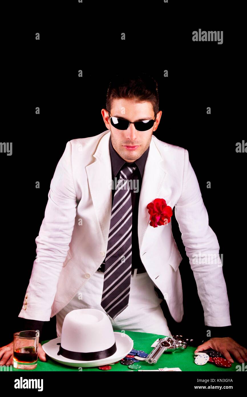 View of a gangster man playing some cards and poker Stock Photo - Alamy