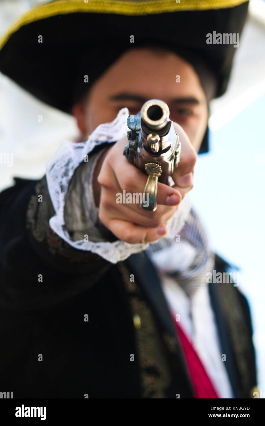 View of a pirate man pointing a gun to the camera Stock Photo - Alamy