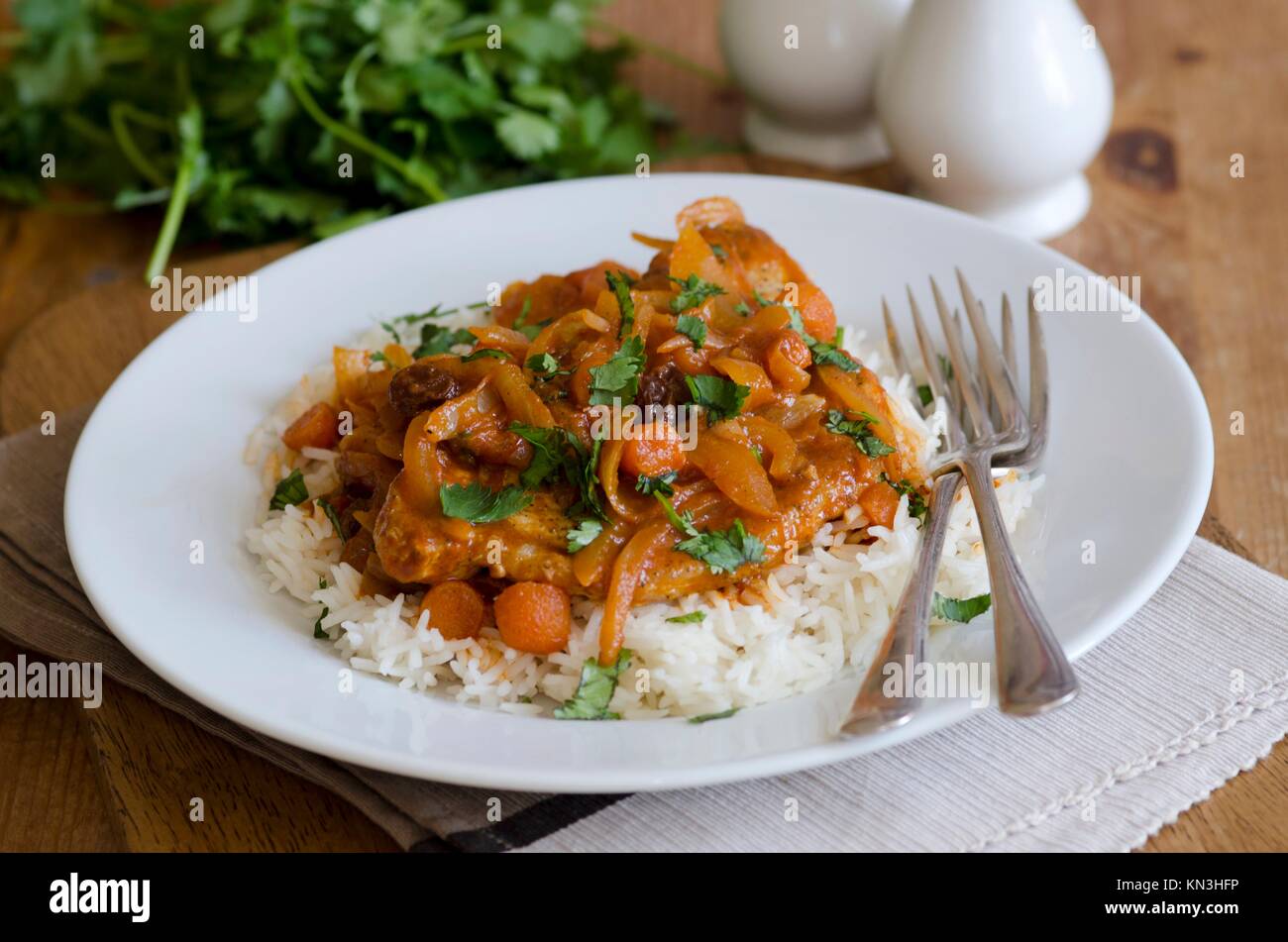 Pork ragout with basmati rice, carrots and cumin. Stock Photo