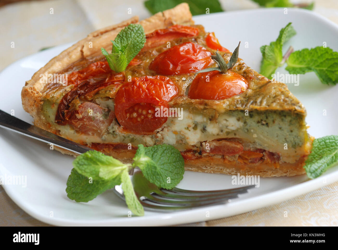 Freshly made tomato, basil and pesto quiche Stock Photo Alamy
