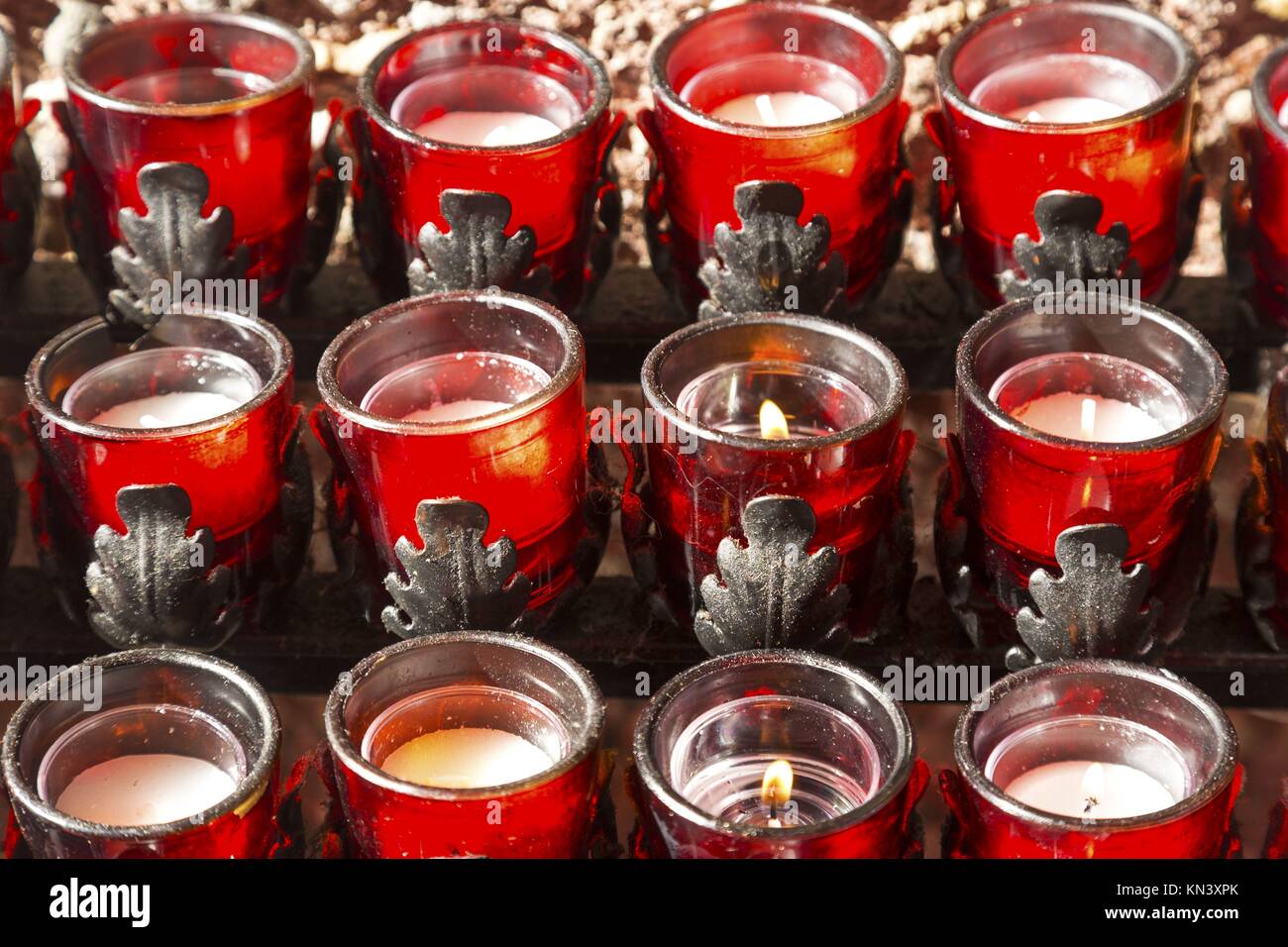 Rows of Wax Candles Burning in Chapel of Holy Cross Roman Catholic