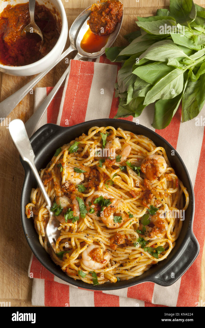 Spaghetti with king prawns and fiery chilli pesto sauce Stock Photo Alamy