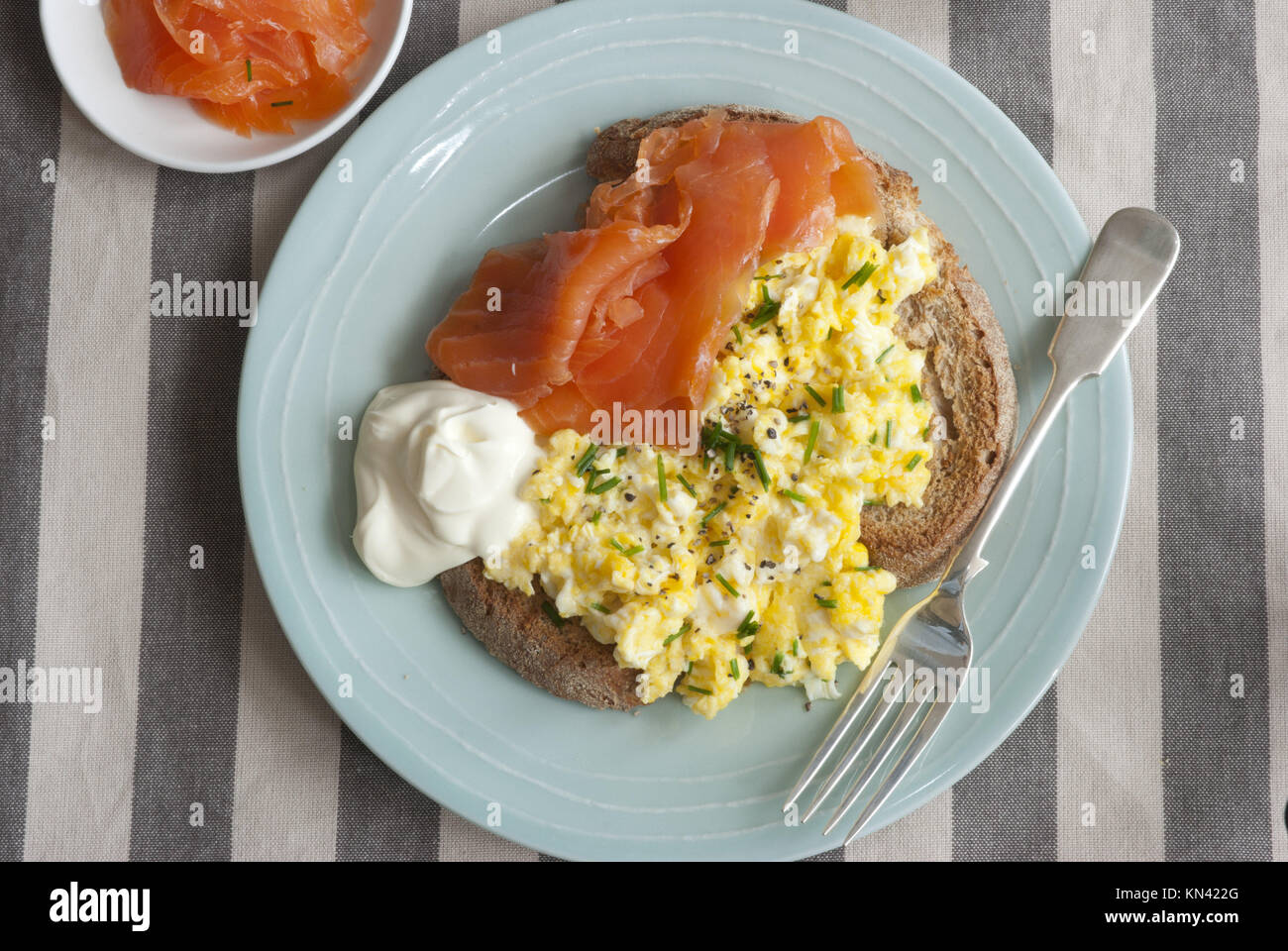 Creamy scrambled eggs on toast with smoked salmon Stock Photo Alamy