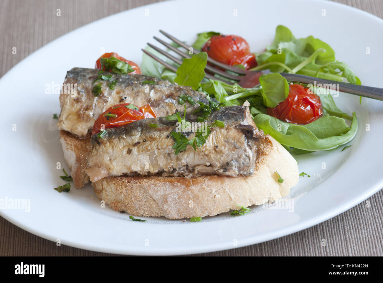 Grilled sardines on toast with side salad Stock Photo Alamy