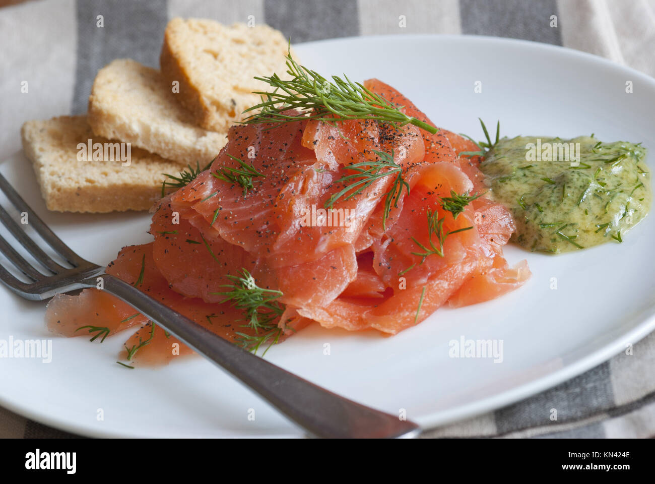 Traditional Scandinavian Gravlax on a plate. Stock Photo