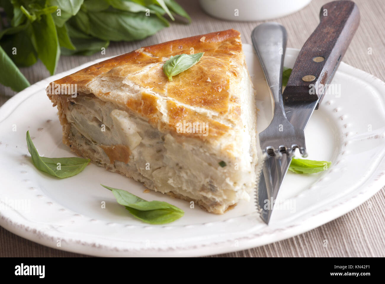 A slice of potato pie on a plate. Stock Photo