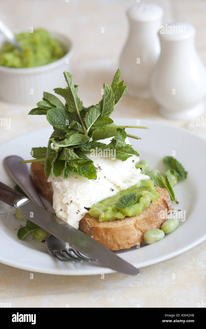 Toast with mozzarella, mushy peas and broad beans Stock Photo Alamy