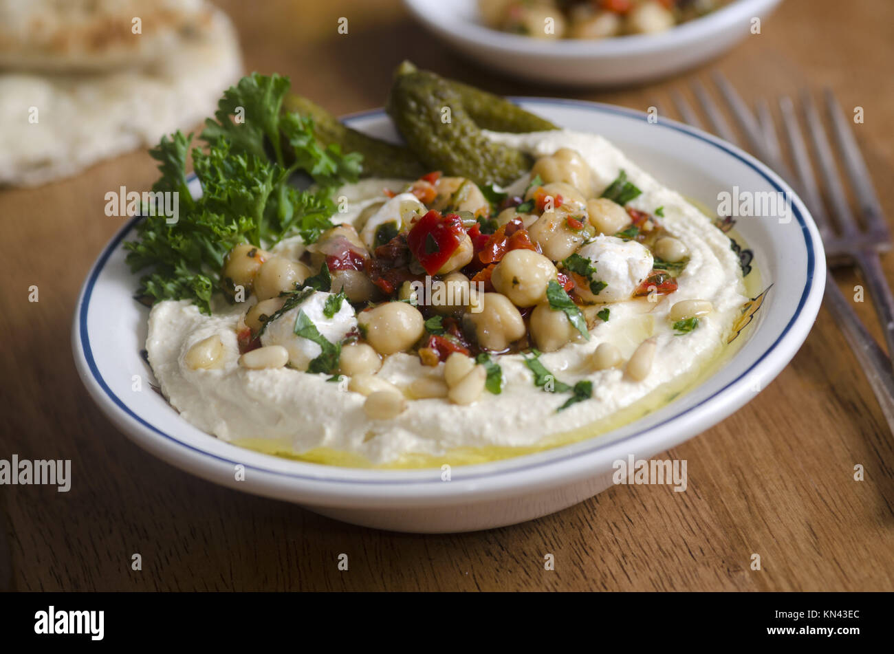 Hummus with chickpeas, feta cheese and gherkins Stock Photo Alamy