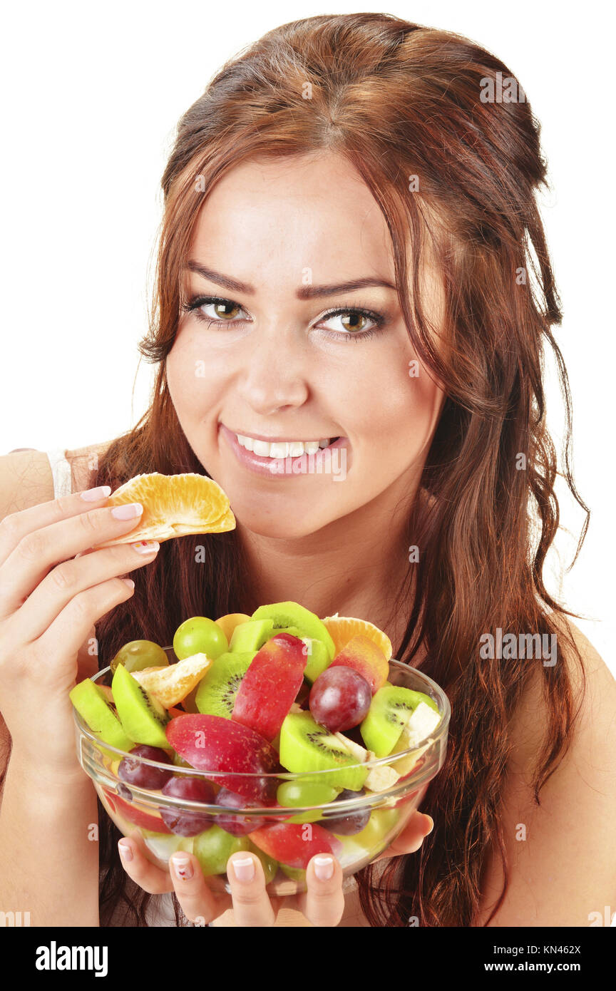 Young woman eating fruit salad Stock Photo Alamy