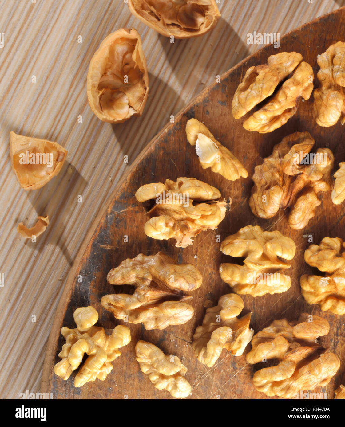 Walnut kernels on old wood chipper Stock Photo Alamy
