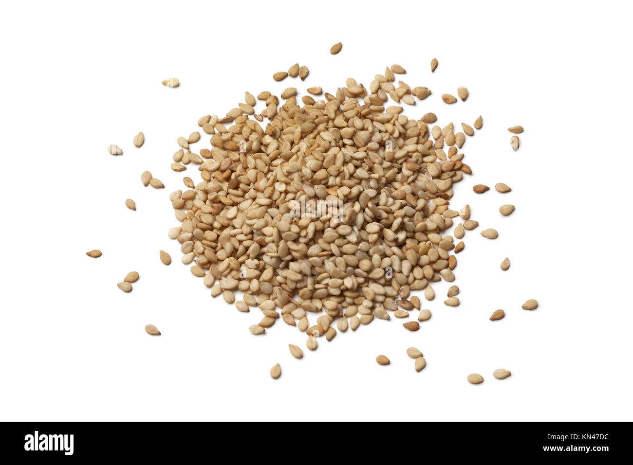Roasted sesame seeds on white background. Stock Photo