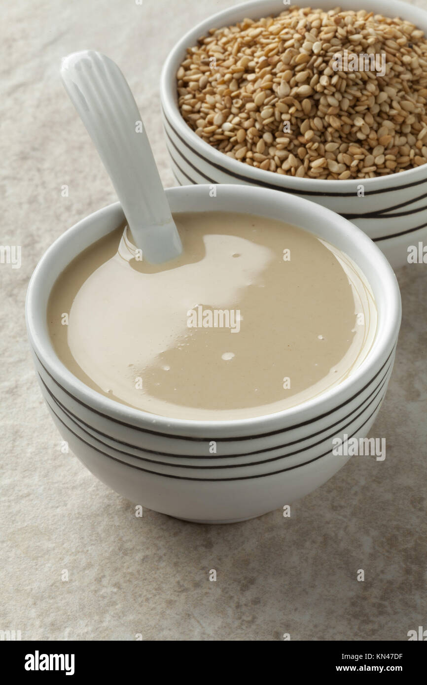 Bowls with tahini paste and roasted sesame seeds Stock Photo Alamy