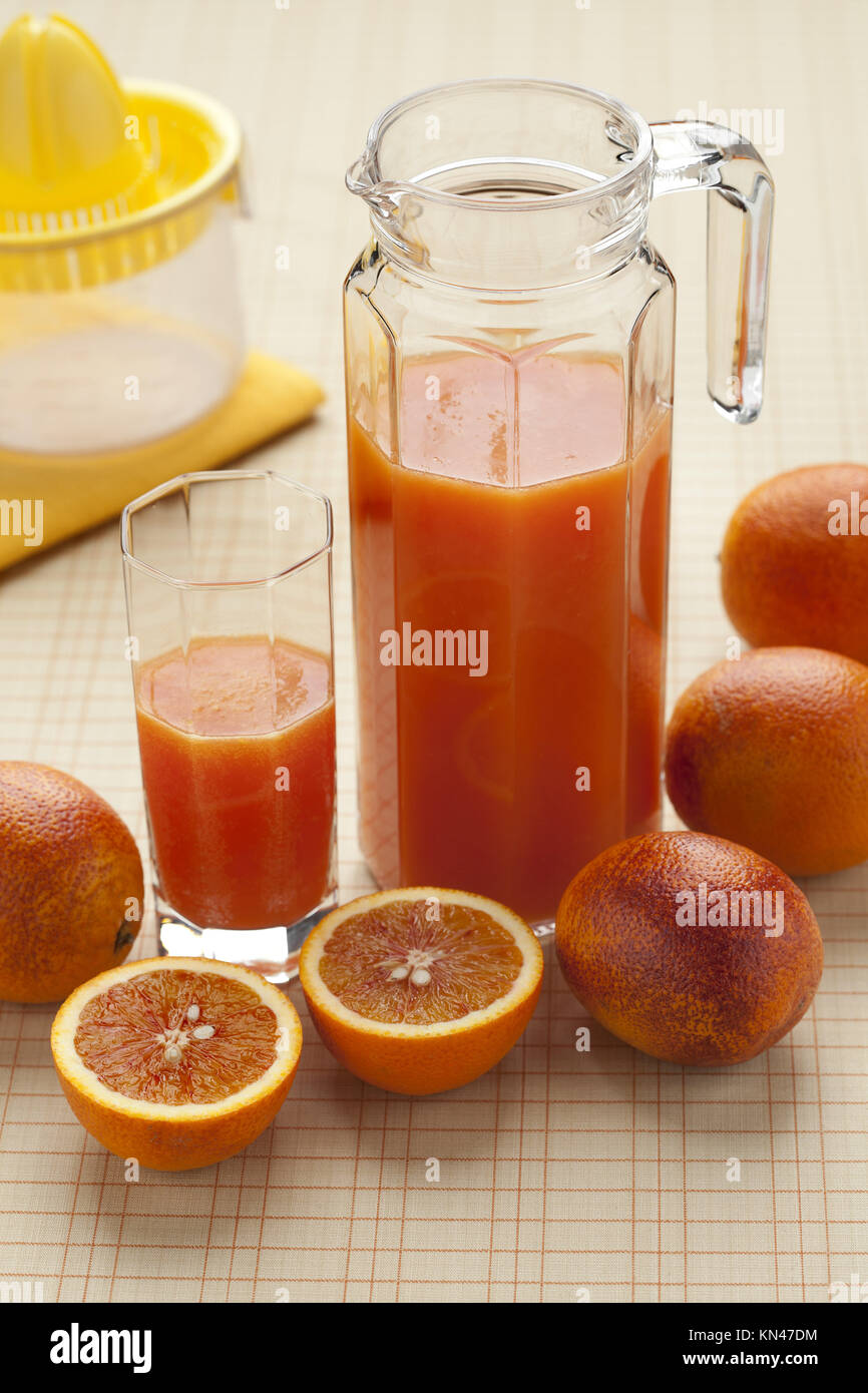 Glass Bottle of Fresh Orange Juice with Fresh Fruits and Flowers Vase on  Wooden Planks Table Stock Photo - Image of fruit, fresh: 239025358