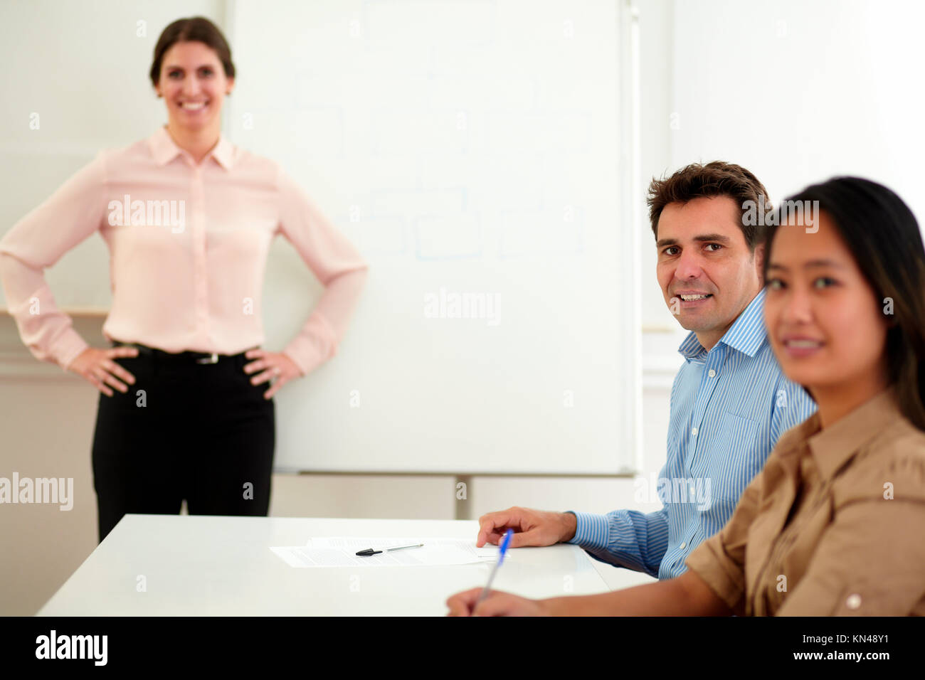 Portrait of a handsome businessman smiling and looking at you on workplace during a meeting. Stock Photo