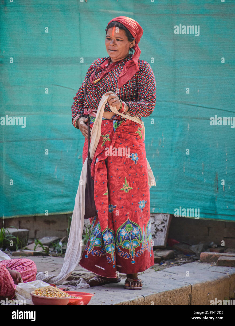 woman in her red saree, malong, Durbar Square, Kathmandu, Nepal Stock Photo