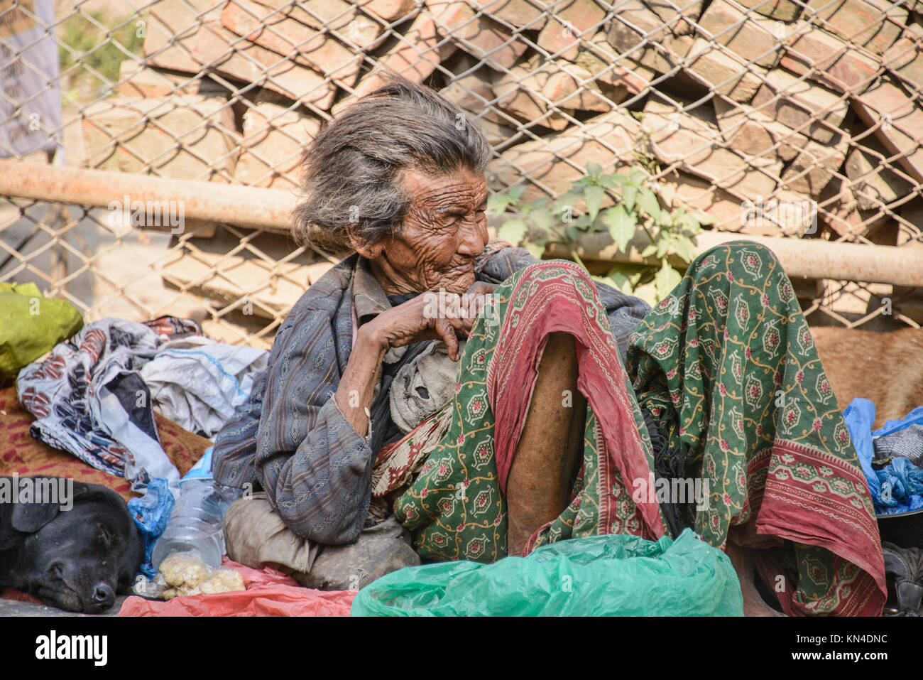 Homeless man on the street in Durbar Square, Kathmandu Stock Photo